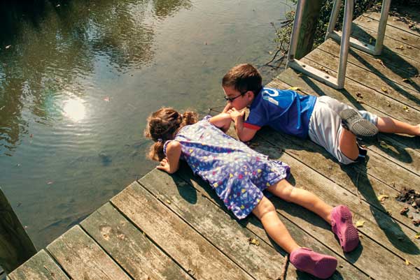 The residents use the community space in various ways depending on their family members. The children love running through the park and playing by the pond, whereas teens play sports and adults walk pets.
